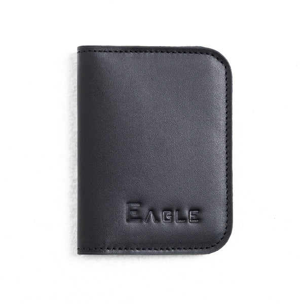 A black leather passport cover or wallet with rounded corners and the brand name 'EAGLE' embossed on the front, shown on a plain white background.